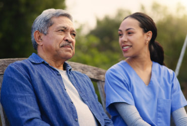 aide looking to an elderly man