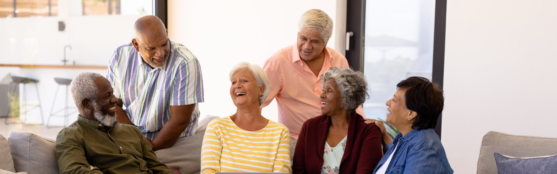 elderly people smiling and talking