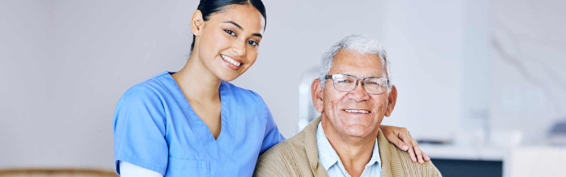 nurse and elderly man smiling