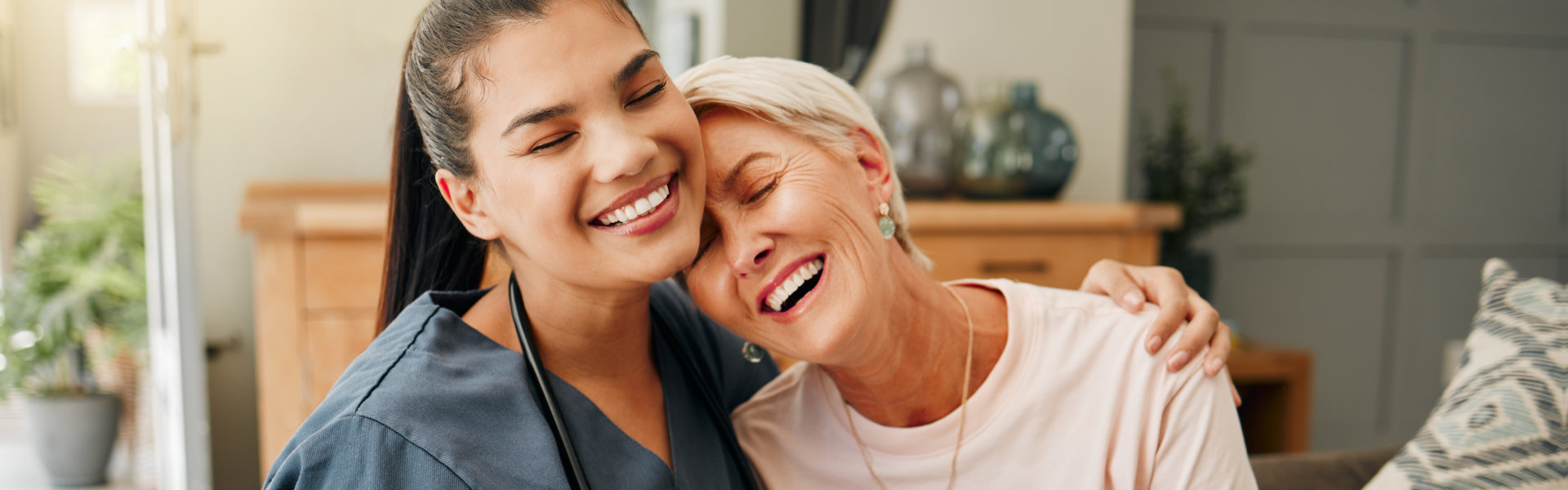 nurse and elderly woman smiling